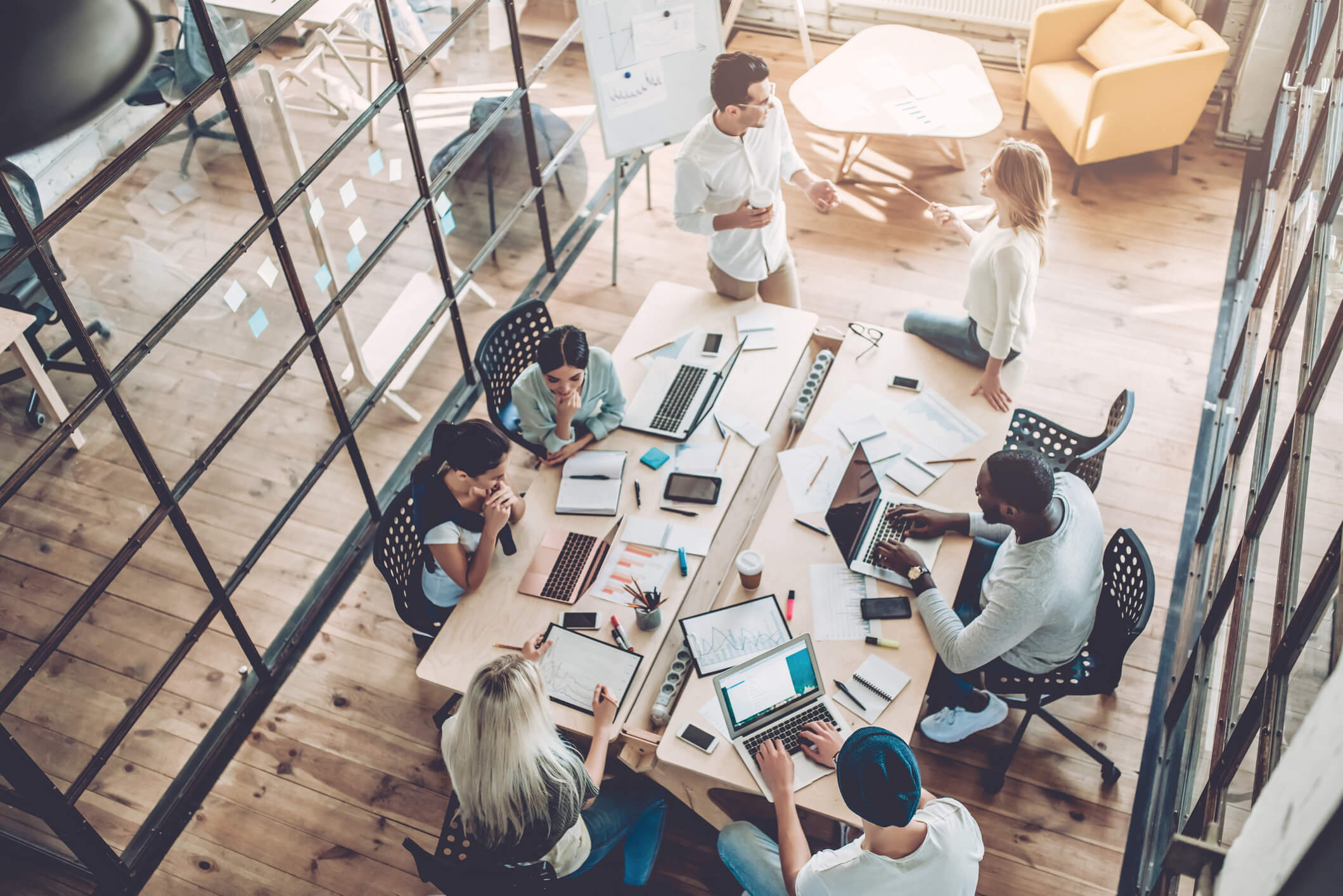 Team collaborating around a table in a modern office